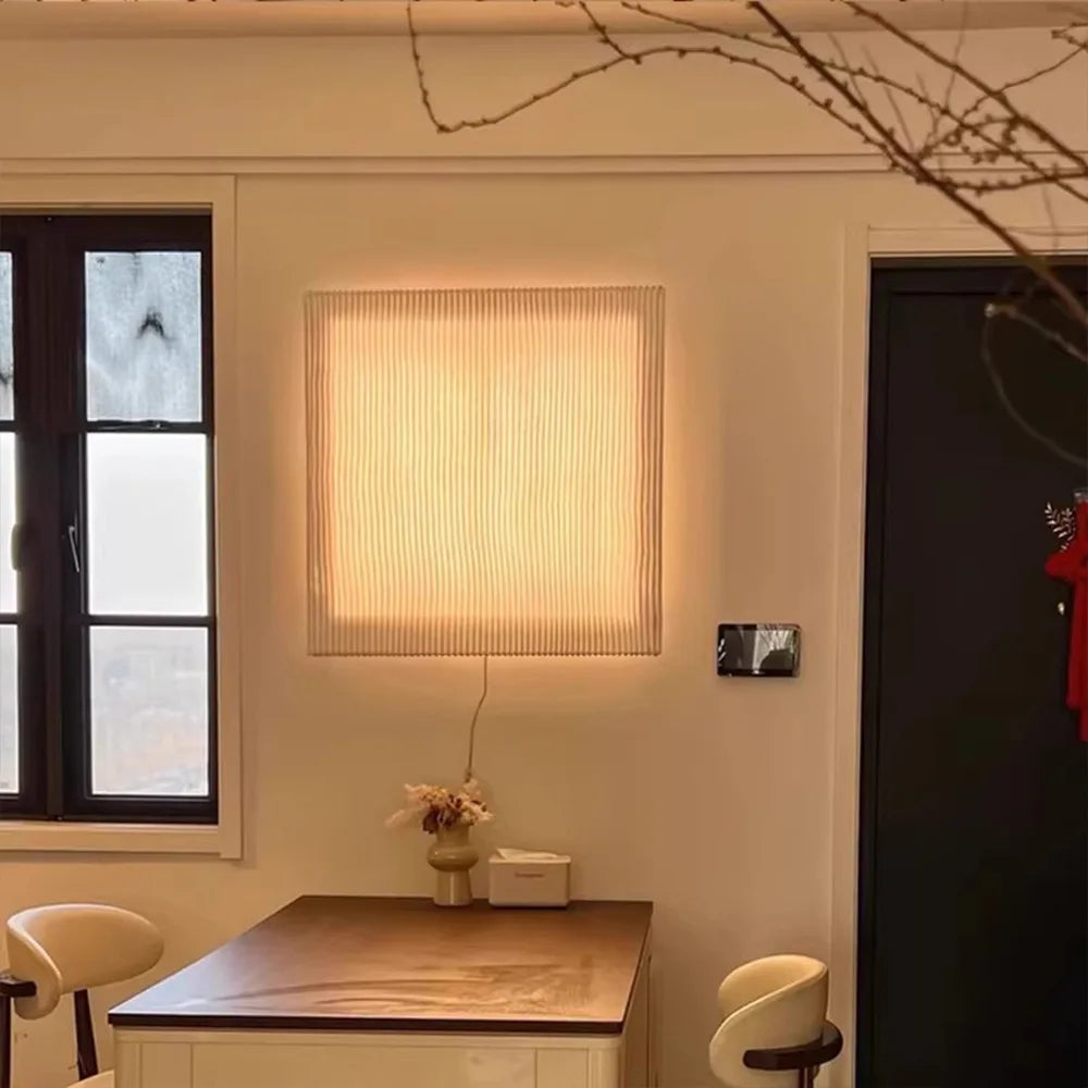 Zora Cove Iron Wall Sconce – Minimalist styled in a living room interior