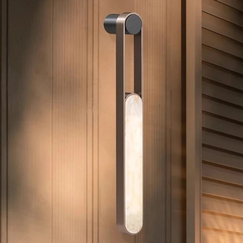 Noma Ridge Marble Wall Sconce – Minimalist styled in a living room interior