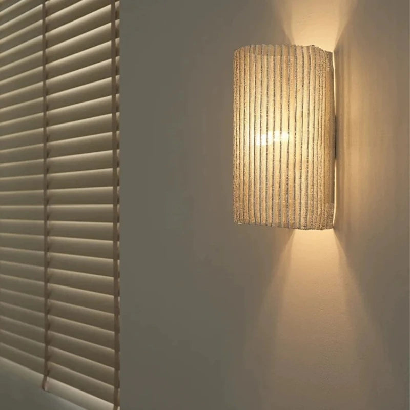 Mora Curve Iron Wall Sconce – Luxury styled in a living room interior