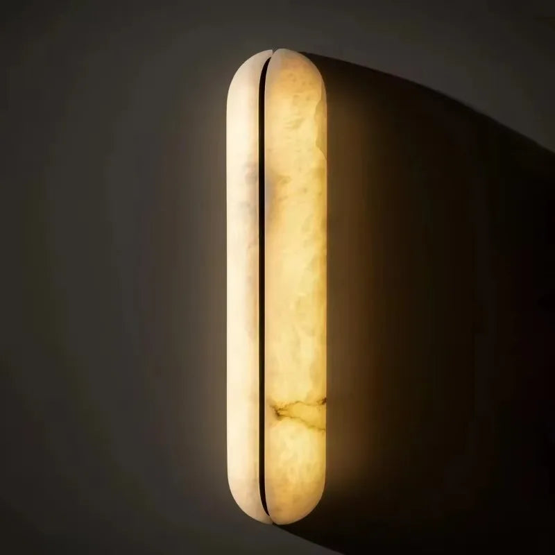 Aera Frame Alabaster Wall Sconce – Luxury styled in a living room interior