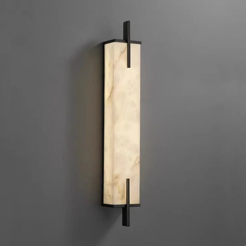 Iris Fold Marble Wall Sconce – Minimalist styled in a living room interior