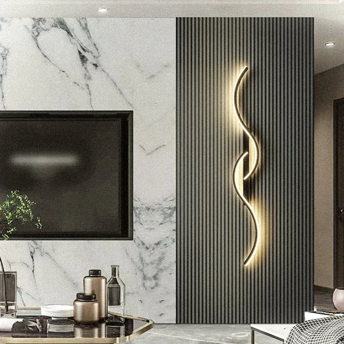 Cora Sculpt Aluminum Wall Sconce – Dimmable styled in a living room interior