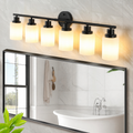 Six-light black LED bathroom vanity and mirror light in a premium marble bathroom