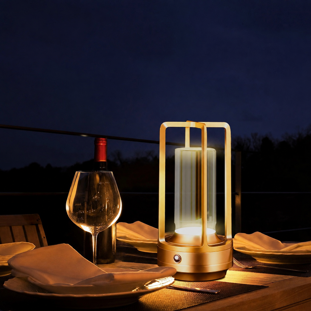 Gold rechargeable cordless table lamp on an evening dining table