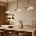 Liora Halo natural stone pendant lights above a premium kitchen island